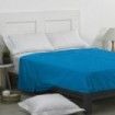 Sábana encimera 50/50 azul escena de cama