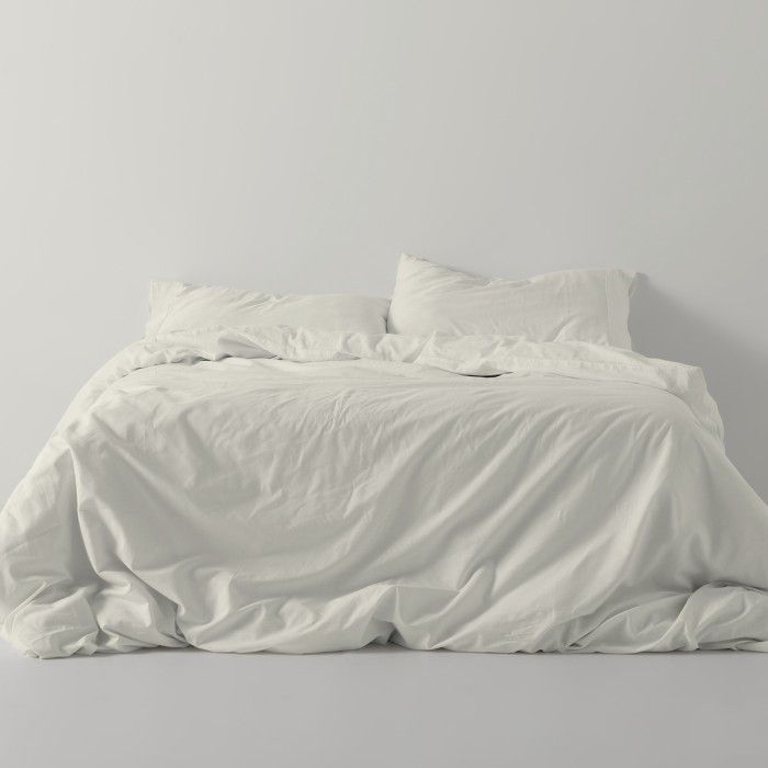 Funda nórdica lisa algodón crema escena de cama