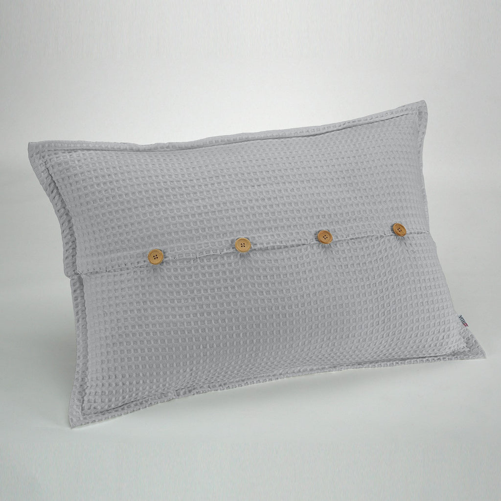 Funda de cojín tejida Banús 50x75 cm color perla. Cierre con botones