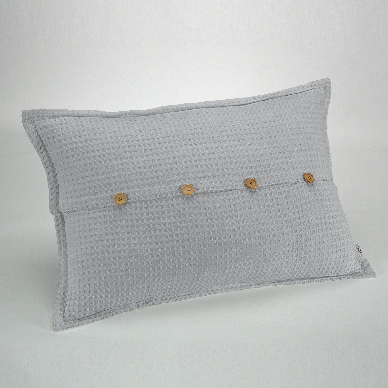 Funda de cojín tejida Banús 50x75 cm color perla. Cierre con botones