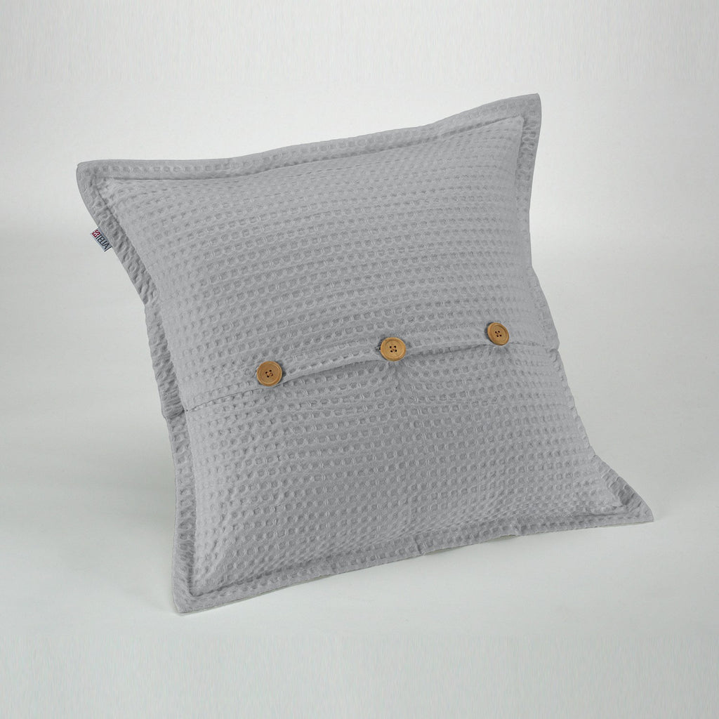Funda de cojín tejida Banús 50x50 cm color perla. Cierre con botones