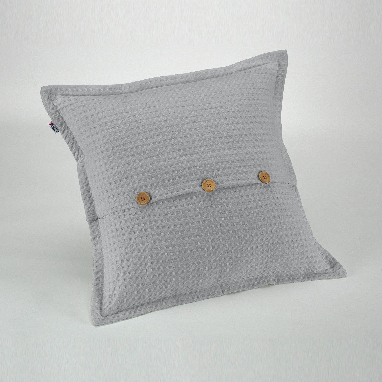Funda de cojín tejida Banús 50x50 cm color perla. Cierre con botones