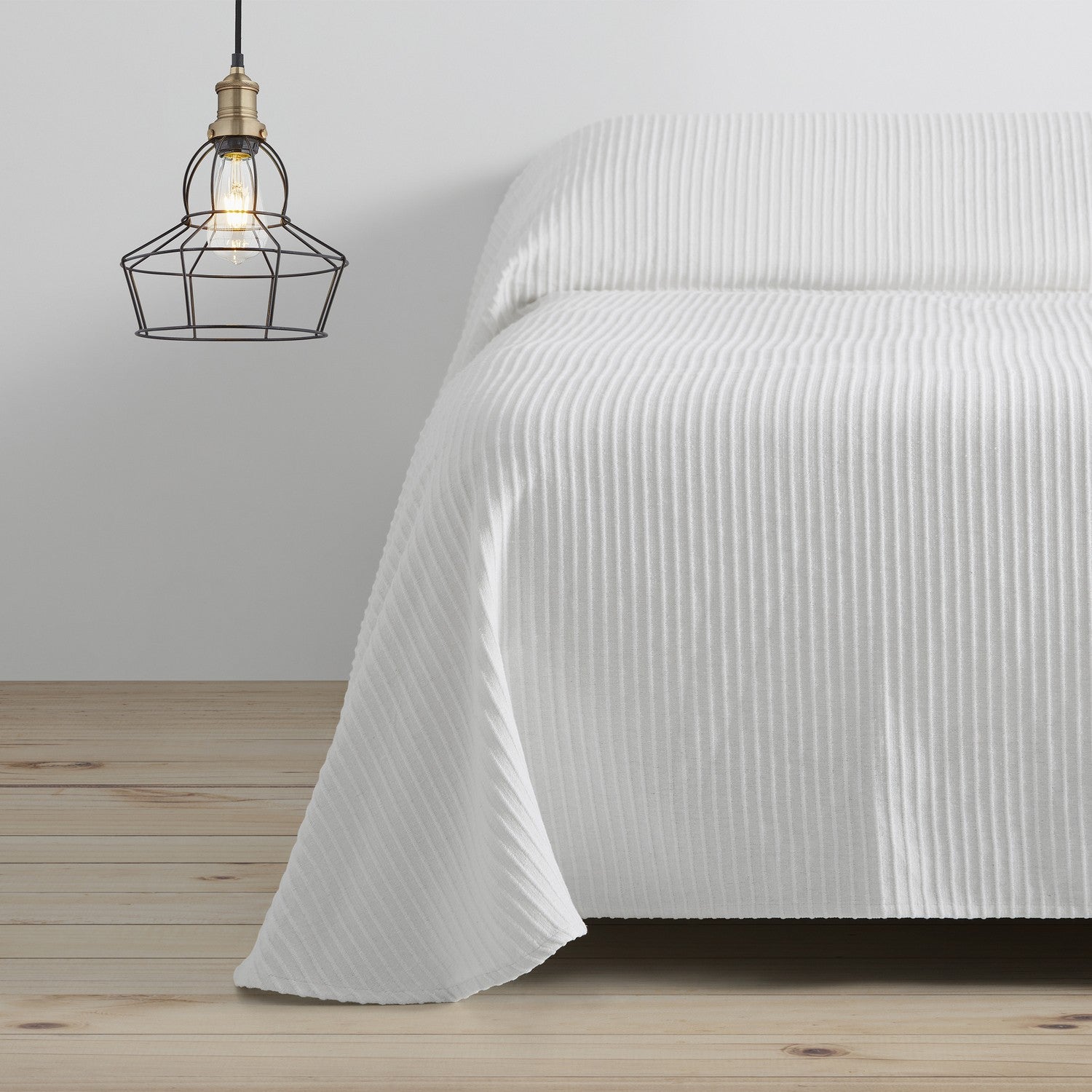 Colcha tejida Bali blanco escena de cama