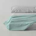 Sábana encimera algodón poliéster aqua escena de cama