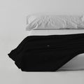 Sábana encimera algodón poliéster negro escena de cama