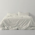 Funda nórdica lisa algodón crema escena de cama