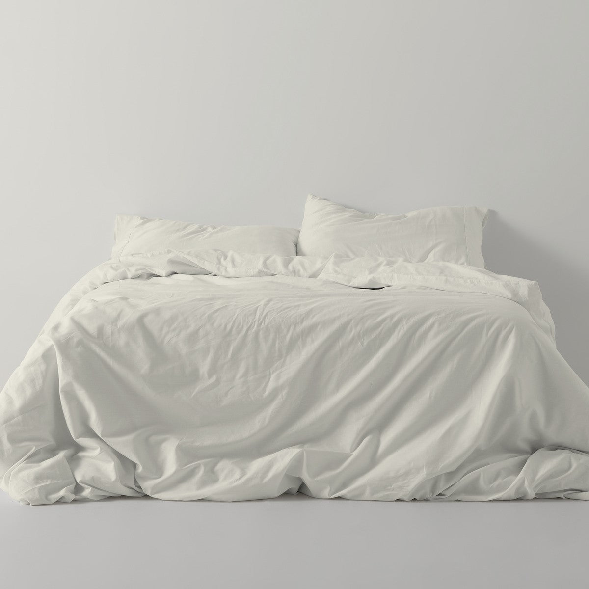 Funda nórdica lisa algodón crema escena de cama